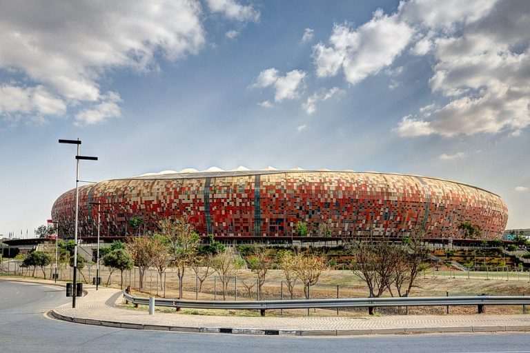 Exploere inside Soccer City stadium: design, construction, seating plan, features, facilities of the FNB Stadium.